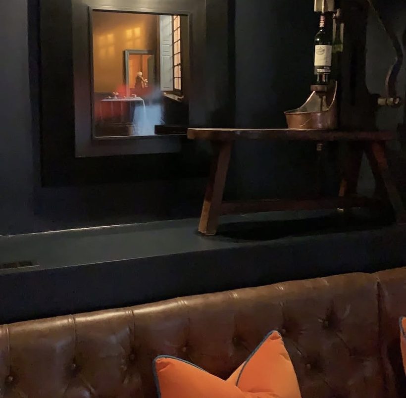 The Nevill Arms — an original French wine corker and La Fenêtre by Pierre-Yves Russo, the painting that set the palette, above a buttoned leather banquette